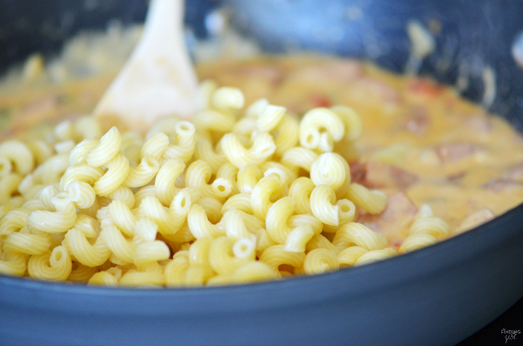 Try out this Cheesy Kielbasa Pasta recipe for an easy weeknight dinner solution! Loaded with flavor, this kielbasa recipe combines Velveeta, Rotel and pasta into a delicious dinner with a spicy kick. Your whole family will love this kielbasa sausage meal.