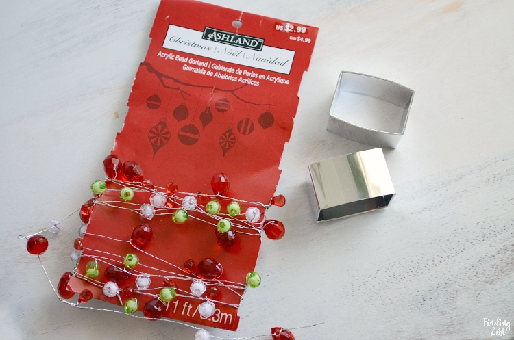 Supplies for homemade holiday napkins rings. Dollar store silver napkin rings and beaded garland