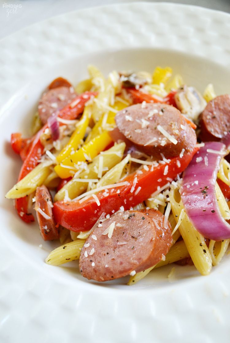 Need a quick dinner recipe? Try this smoked sausage penne pasta recipe that can be on your table in under 30 minutes! Loaded with fresh sauteed vegetables and Parmesan cheese, the whole family will love this meal. Also included are more smoked sausage recipes to try!