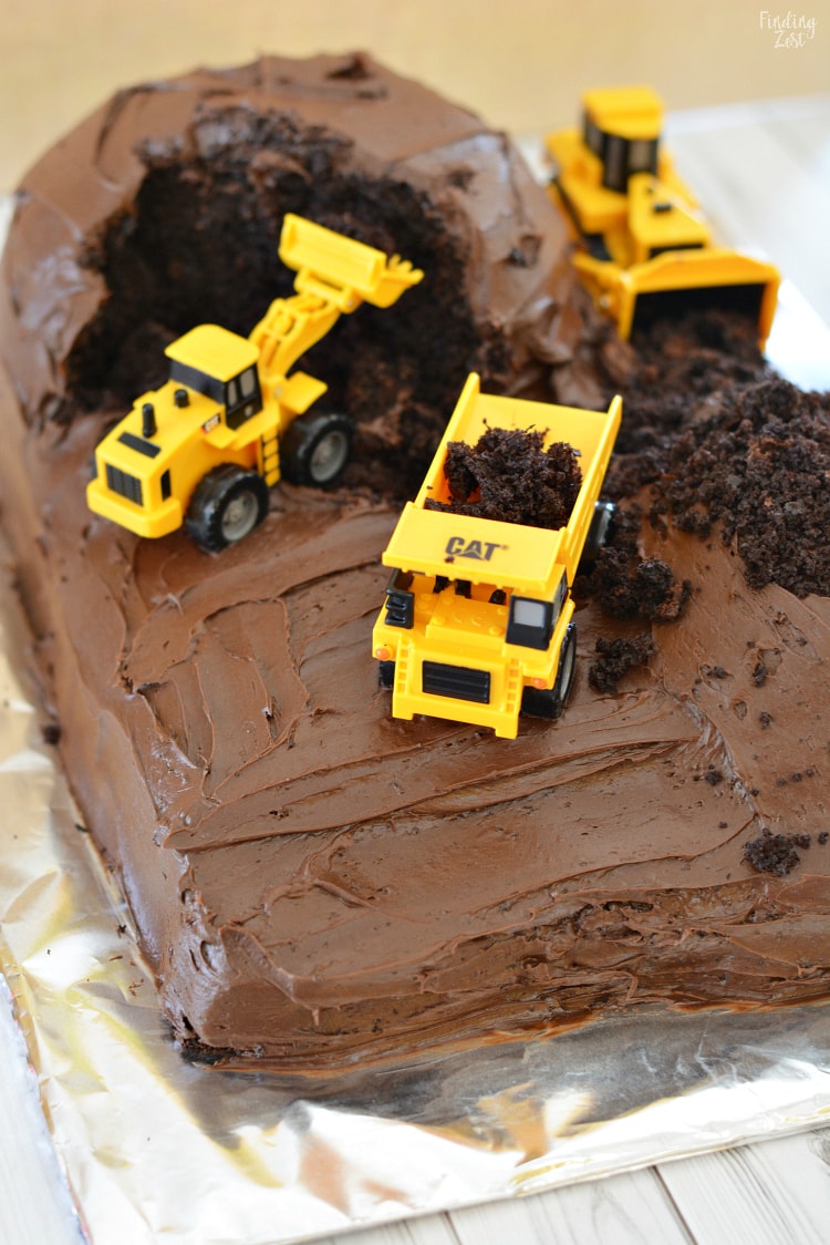 Learn how easy it is to make a construction birthday cake, even with no cake decorating experience or special tools! This construction cake is the perfect base for adding candy rocks or cookie dirt for an even more elaborate design. Kids and adults will love this simple birthday cake idea.