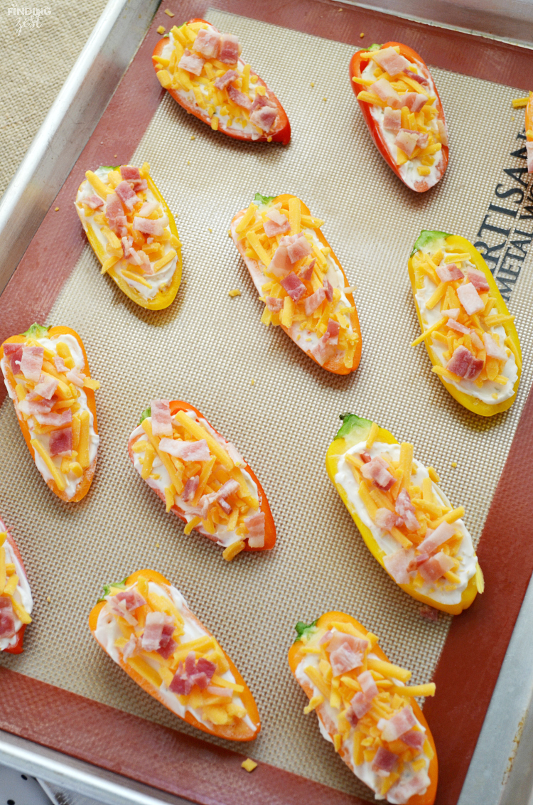 Try these sweet pepper poppers, a delicious low carb appetizer. Make them for your next holiday gathering, celebration or as a game day snack! You don't have to be on a low carb diet to fall in love with these low carb appetizers loaded with cheese and bacon!