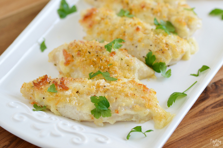 Give these delicious Parmesan Crusted Chicken Tenders a try for your next easy weeknight meal. These homemade chicken tenders have a mild crunchy coating that kids love. The whole family will go nuts for these baked chicken tenders that can be on your table in just 20 minutes!