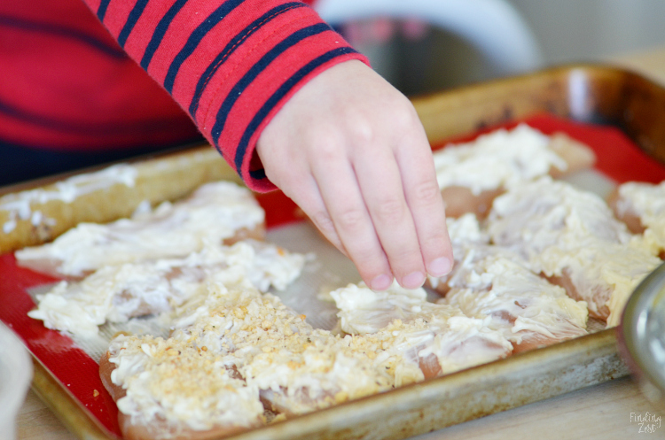 Give these delicious Parmesan Crusted Chicken Tenders a try for your next easy weeknight meal. These homemade chicken tenders have a mild crunchy coating that kids love. The whole family will go nuts for these baked chicken tenders that can be on your table in just 20 minutes!