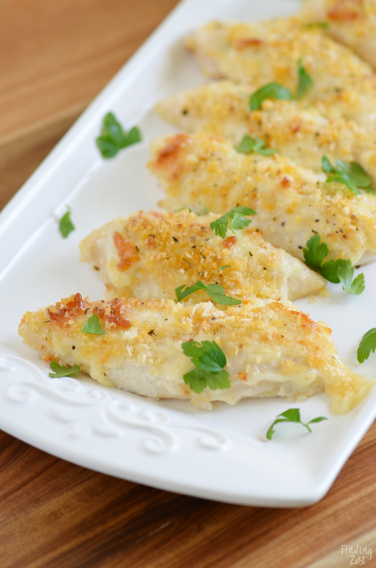 Give these delicious Parmesan Crusted Chicken Tenders a try for your next easy weeknight meal. These homemade chicken tenders have a mild crunchy coating that kids love. The whole family will go nuts for these baked chicken tenders that can be on your table in just 20 minutes!