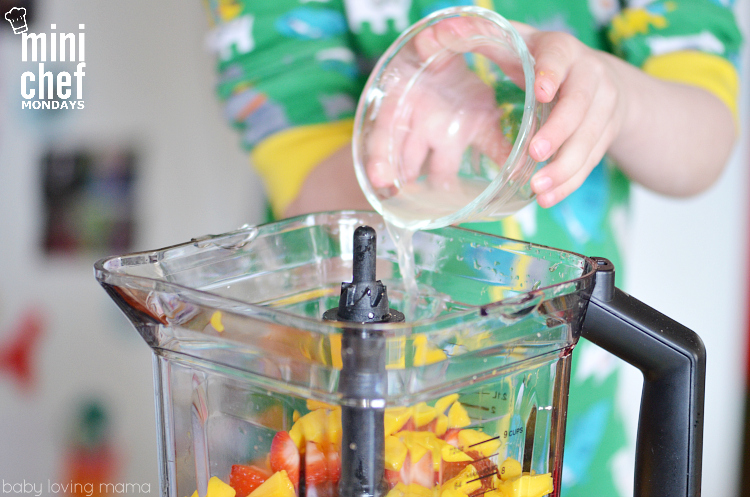 Child Adding Lime Juice to Blender for Italian Ice