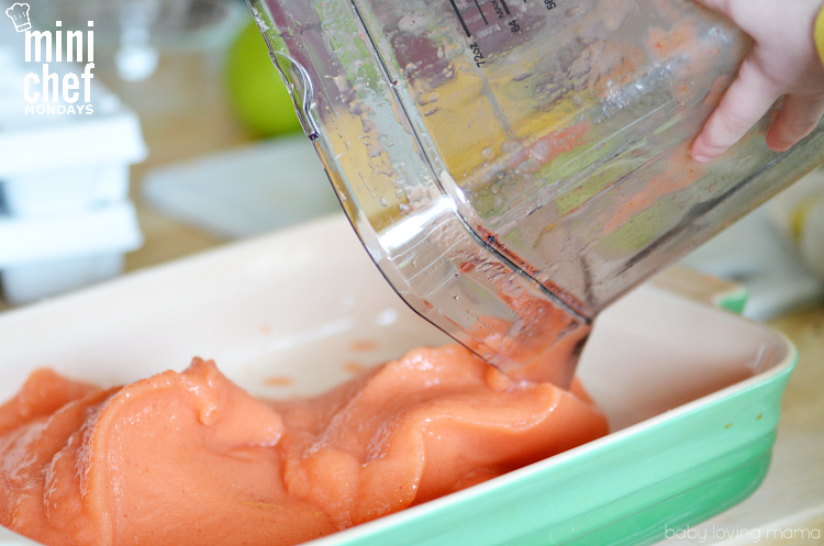 Child Pouring Out Strawberry Mango Puree