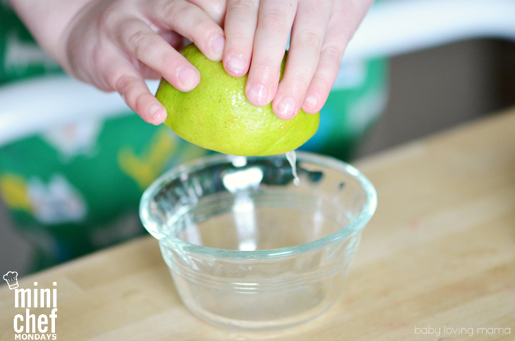 Child Squeezing Lime for Italian Ice