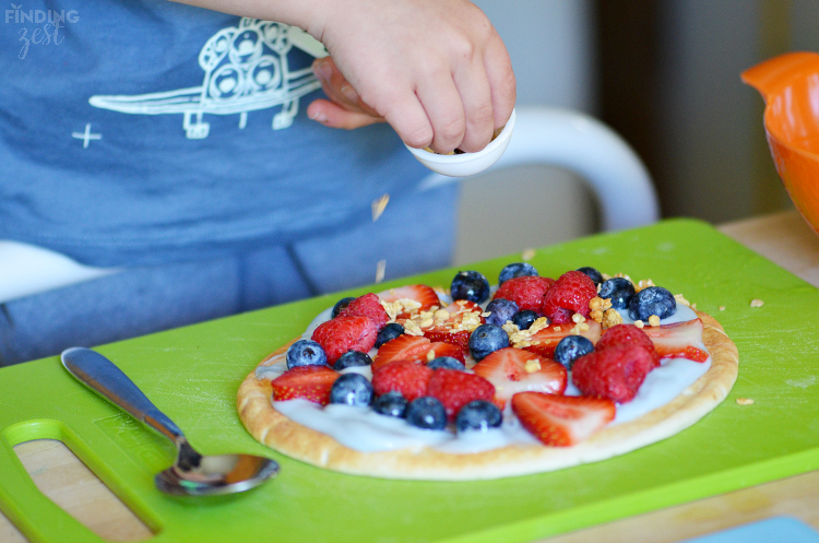 Sprinkling Granola onto Yogurt Pizza