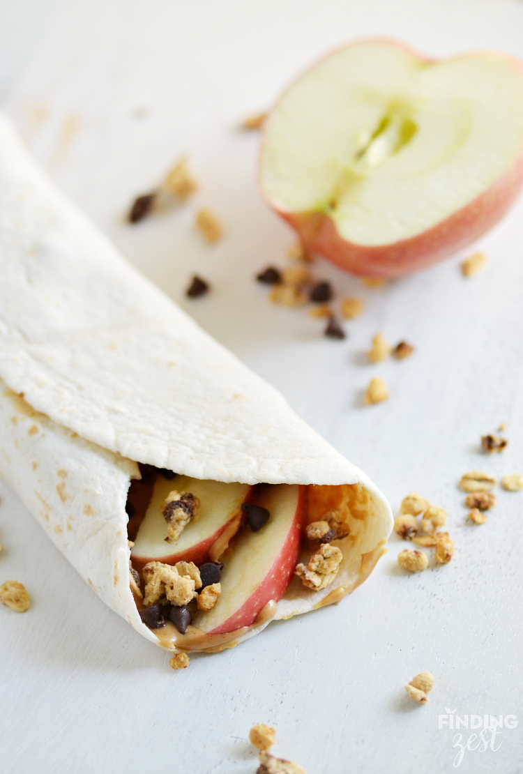 Enjoy this crunchy apple peanut butter wrap as a breakfast on the go, fun lunch option or hearty after school snack. It is protein packed. Kids will love this wrap for back to school!