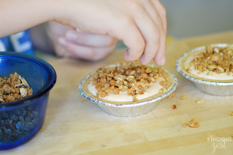 Adding Crumb Topping to Mini Pumpkin Pies