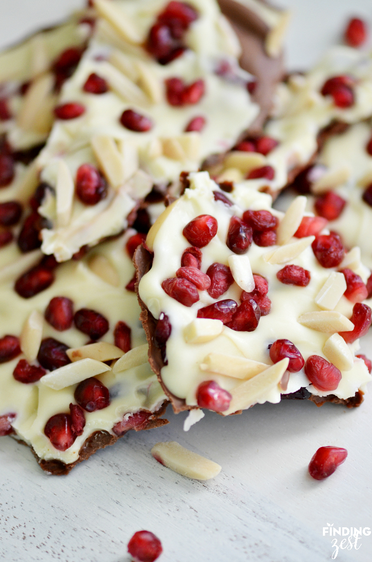 This Pomegranate Almond Chocolate Bark is a tasty holiday recipe featuring both white and milk chocolate, lightly toasted slivered almond and fresh pomegranates. This delicious combination of flavors is sure to impress!