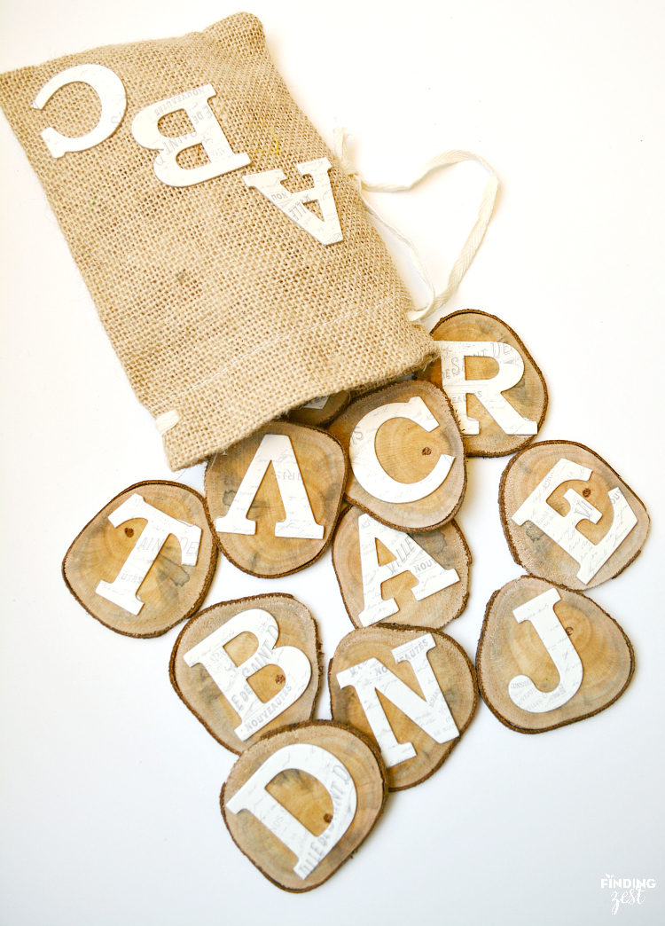 Make these DIY Wood Alphabet Learning Slices to teach your preschooler! Includes four learning activities to use with this simple wooden alphabet tool.