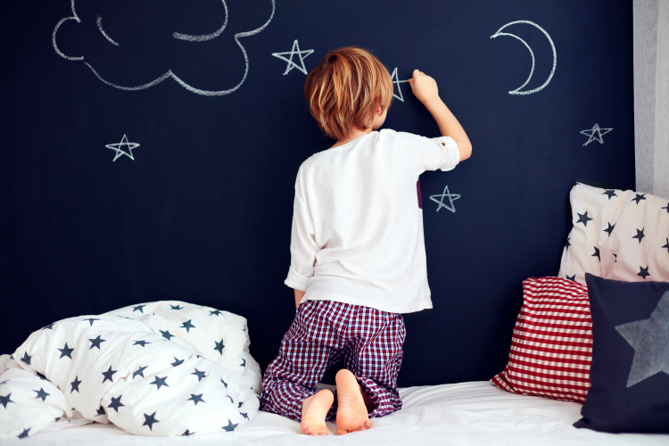 Boy Drawing On Chalk Wall In Bedroom Finding Zest