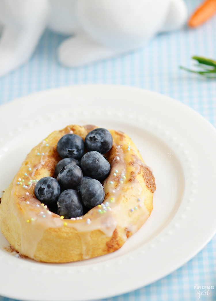 Give these easy Easter Cinnamon Rolls a try for breakfast. You won't believe how simple it is to make bunny and berry filled Easter egg cinnamon rolls! 