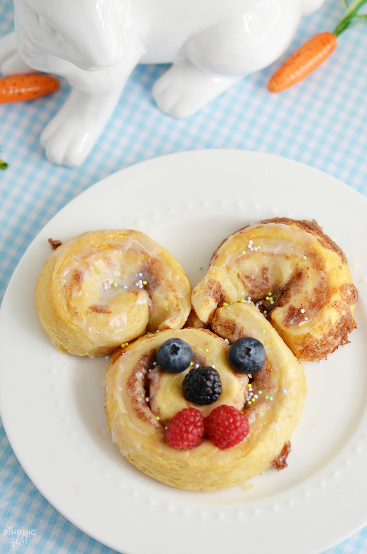 Give these easy Easter Cinnamon Rolls a try for breakfast. You won't believe how simple it is to make bunny and berry filled Easter egg cinnamon rolls! 