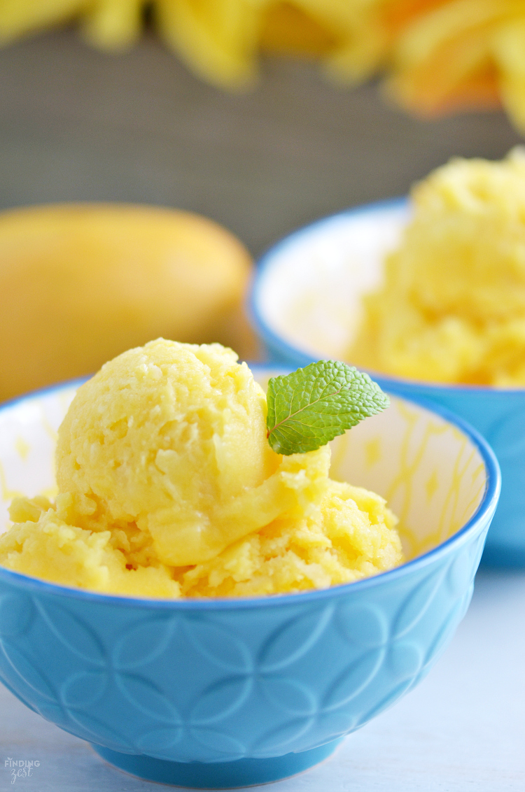 Only three ingredients and a blender are needed to make this homemade Mango Pineapple Sorbet! Add toasted coconut & a cherry for a tropical dessert! Kids will love this healthier alternative to ice cream.