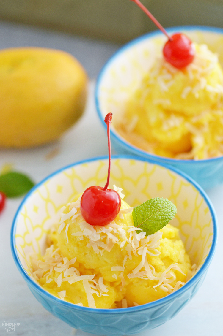 Only three ingredients and a blender are needed to make this homemade Mango Pineapple Sorbet! Add toasted coconut & a cherry for a tropical dessert! Kids will love this healthier alternative to ice cream.