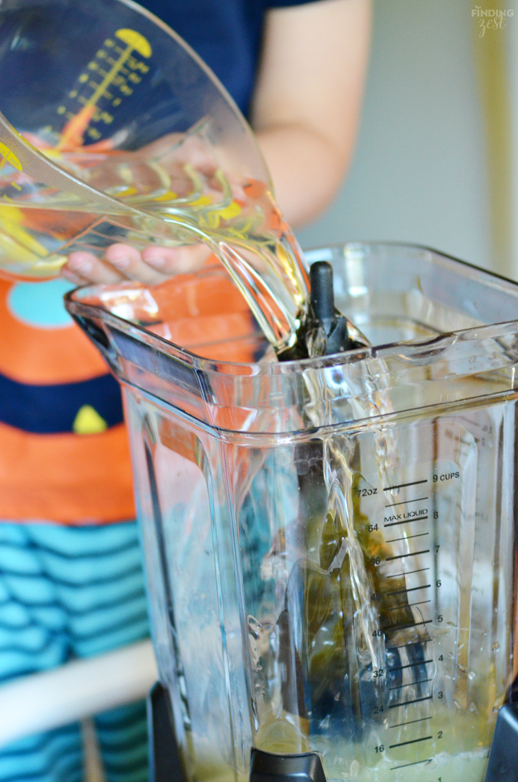 Beat the summer heat with this refreshing Homemade Frozen Lemonade recipe! Made with fresh lemons, this frothy drink is simple and delicious! Make this kid friendly drink at your next celebration.