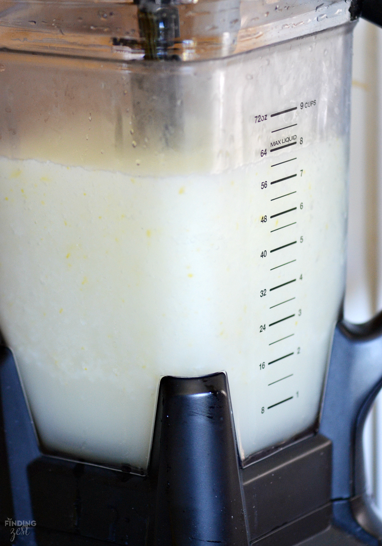 Beat the summer heat with this refreshing Homemade Frozen Lemonade recipe! Made with fresh lemons, this frothy drink is simple and delicious! Make this kid friendly drink at your next celebration.