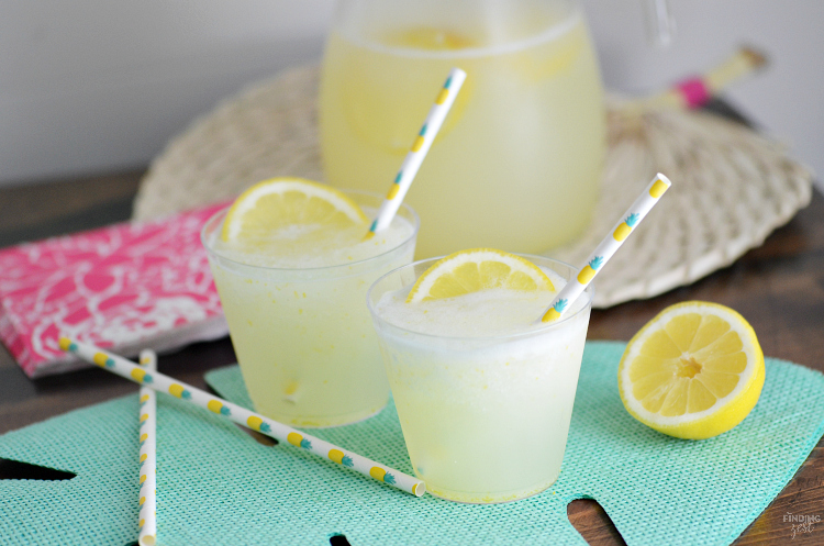 Beat the summer heat with this refreshing Homemade Frozen Lemonade recipe! Made with fresh lemons, this frothy drink is simple and delicious! Make this kid friendly drink at your next celebration.