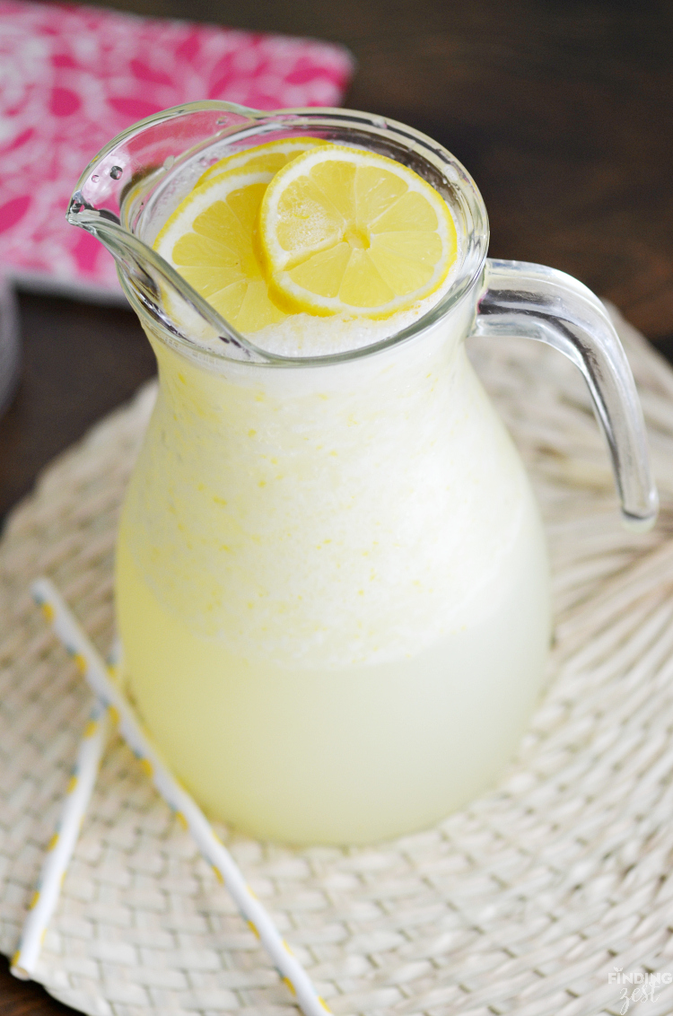 Beat the summer heat with this refreshing Homemade Frozen Lemonade recipe! Made with fresh lemons, this frothy drink is simple and delicious! Make this kid friendly drink at your next celebration.