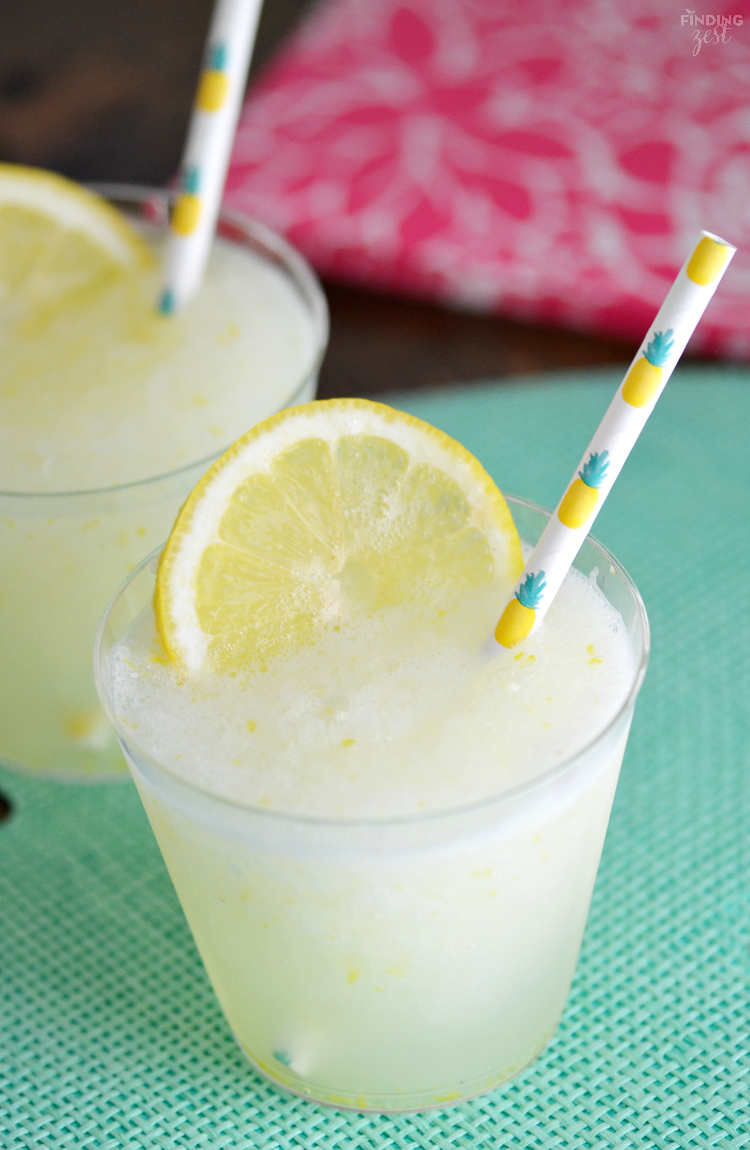 Beat the summer heat with this refreshing Homemade Frozen Lemonade recipe! Made with fresh lemons, this frothy drink is simple and delicious! Make this kid friendly drink at your next celebration.