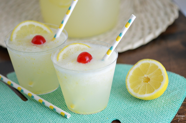 Beat the summer heat with this refreshing Homemade Frozen Lemonade recipe! Made with fresh lemons, this frothy drink is simple and delicious! Make this kid friendly drink at your next celebration.