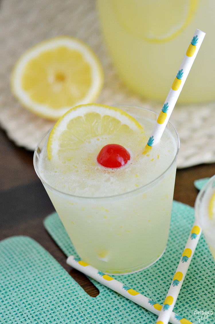 Beat the summer heat with this refreshing Homemade Frozen Lemonade recipe! Made with fresh lemons, this frothy drink is simple and delicious! Make this kid friendly drink at your next celebration.