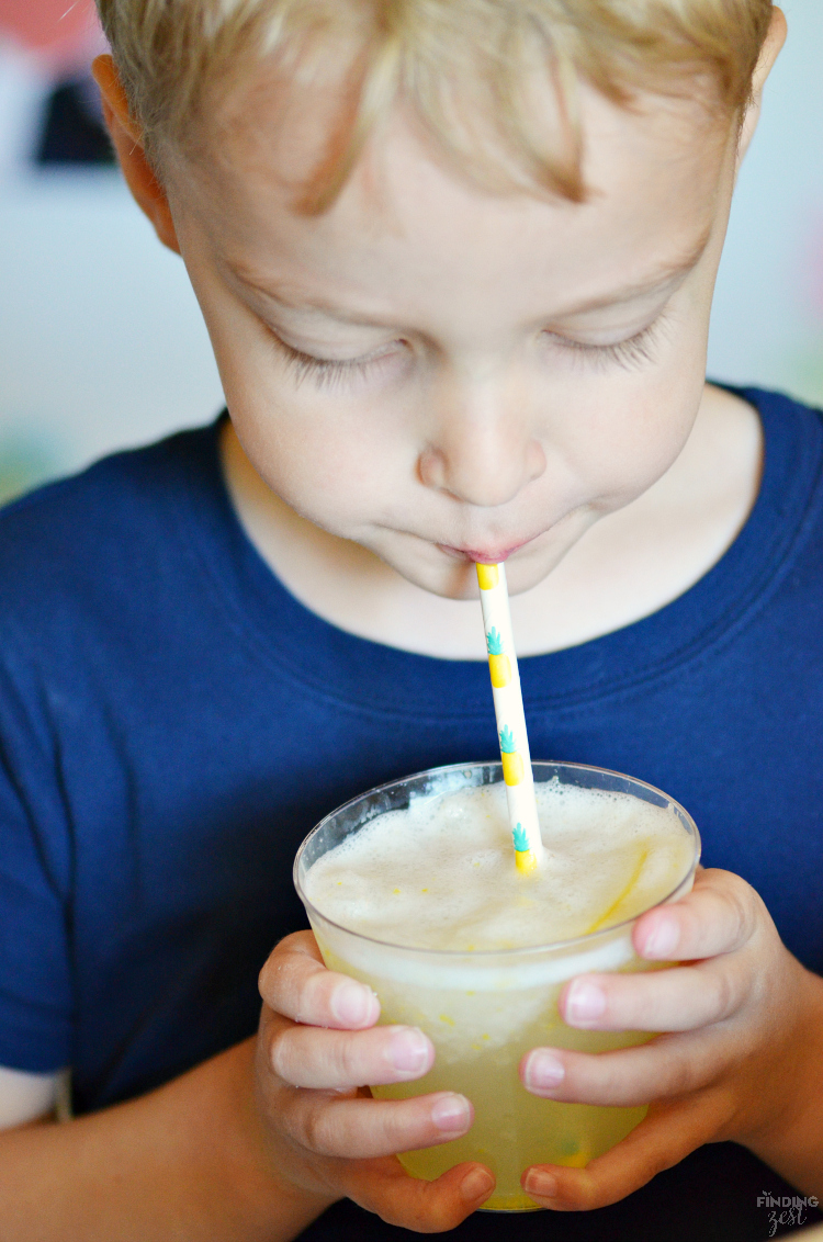 Beat the summer heat with this refreshing Homemade Frozen Lemonade recipe! Made with fresh lemons, this frothy drink is simple and delicious! Make this kid friendly drink at your next celebration.