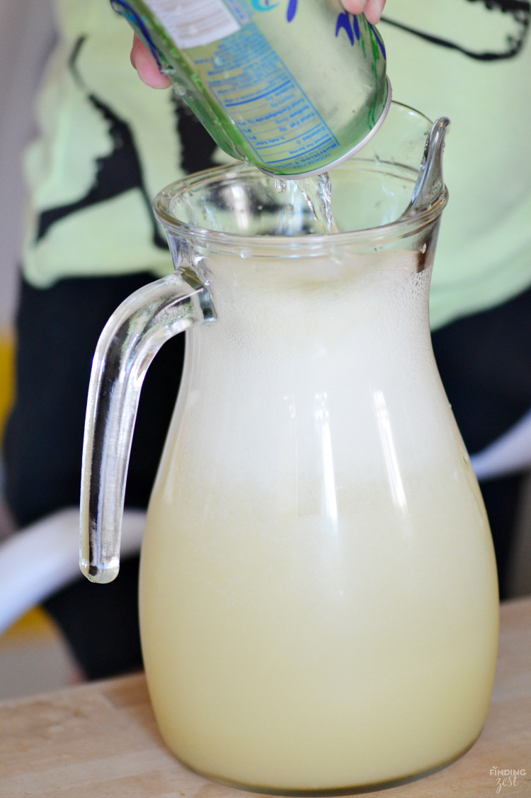 Throwing an mermaid, pool or ocean themed party? This Mermaid Punch recipe is quick and delicious featuring tropical flavors! Your guests will love this blue pina colada punch!