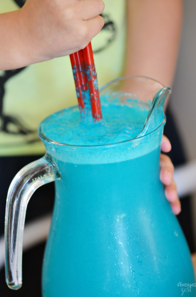 Throwing an mermaid, pool or ocean themed party? This Mermaid Party Punch recipe is quick and delicious featuring tropical flavors! Your guests will love this blue pina colada punch!