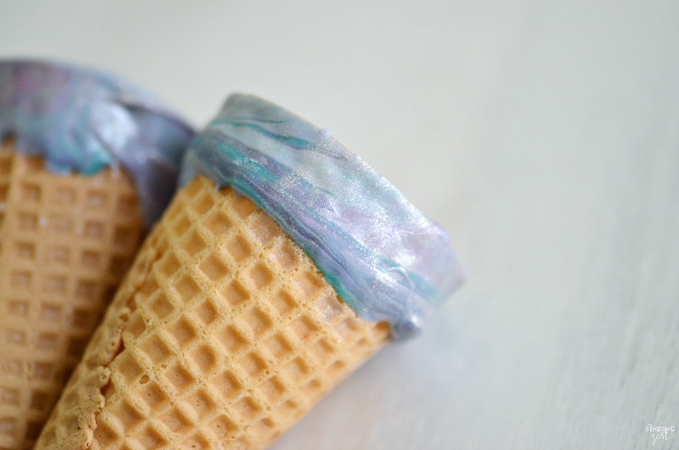 Kick dessert up a notch with these sparkling mermaid ice cream cones! Kids will love these chocolate dipped cones. Perfect for a mermaid or frozen themed birthday party!