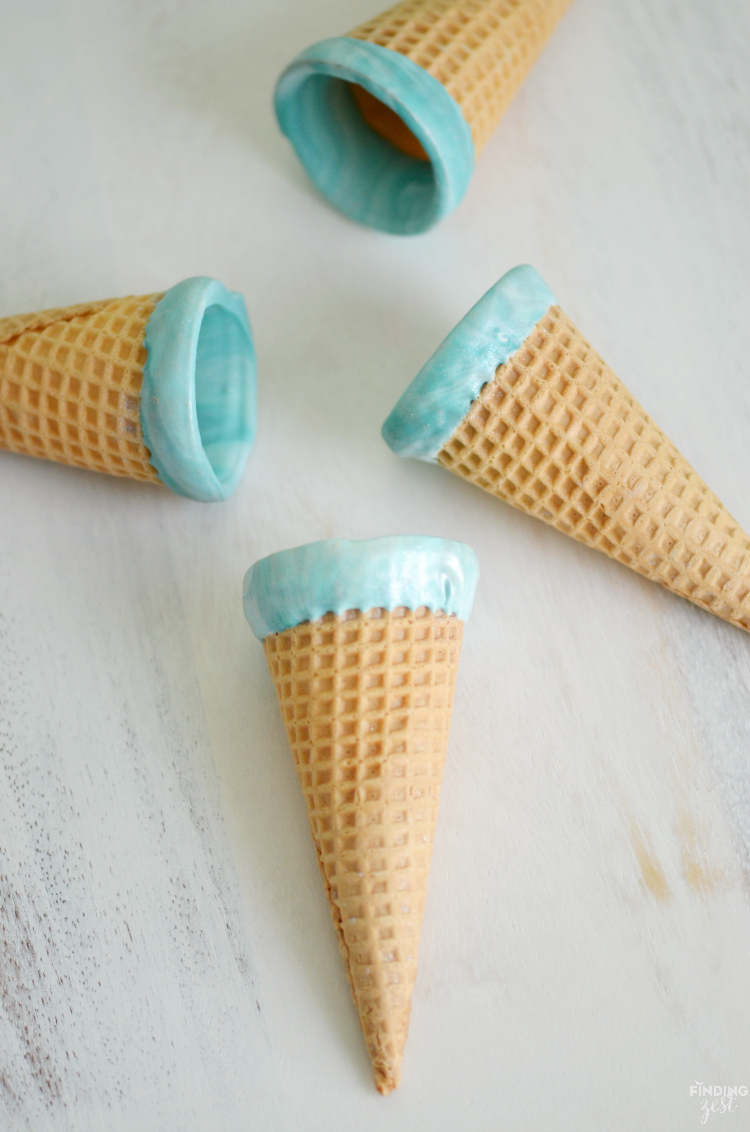 Kick dessert up a notch with these sparkling mermaid ice cream cones! Kids will love these chocolate dipped cones. Perfect for a mermaid or frozen themed birthday party!