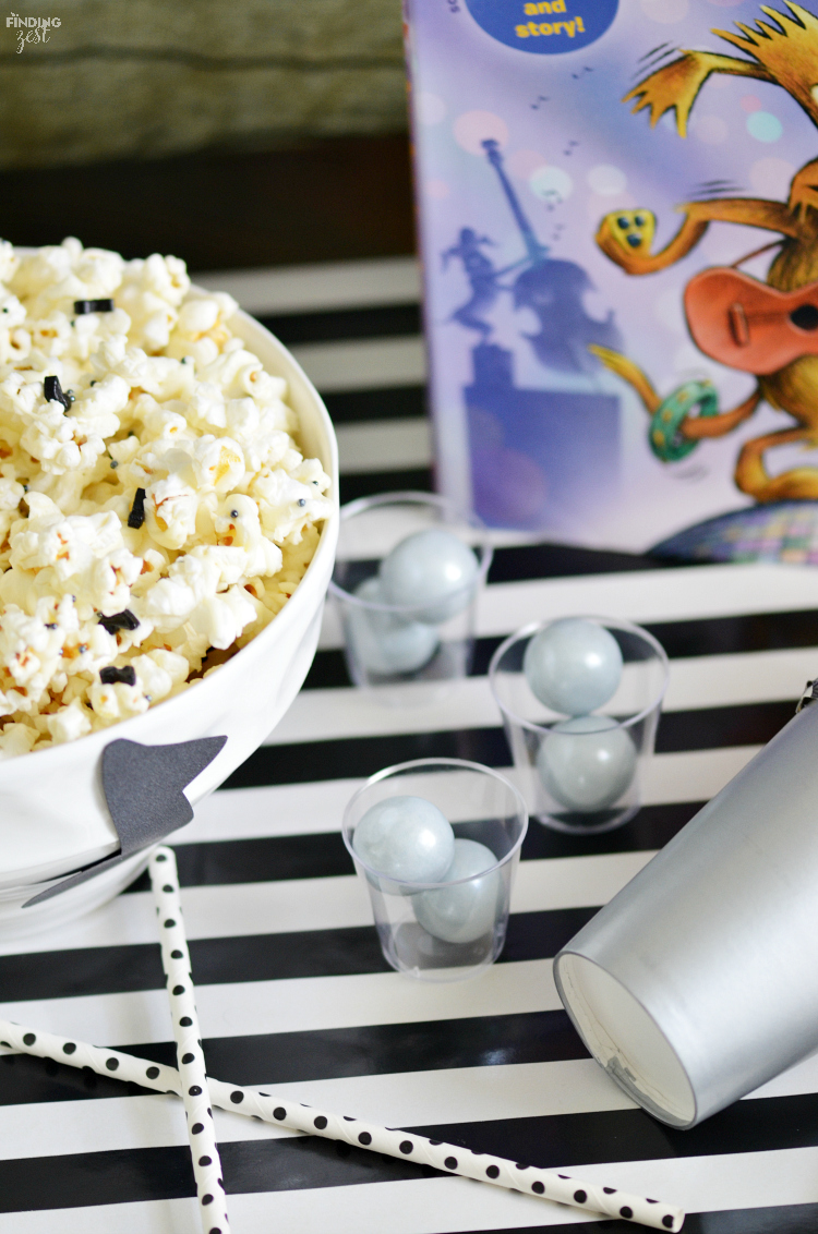 Make this easy white chocolate drizzle popcorn recipe with some homemade musical instruments for kids to host your own Groovy Joe party!