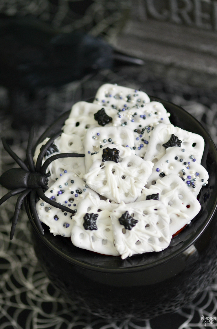These Halloween chocolate dipped pretzels feature a spooky spider web with spider sprinkles. Only four ingredients are required to make this Halloween treat for kids! Give this fun no-bake dessert a try.