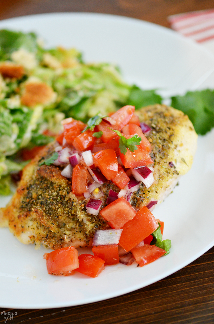 This delicious Parmesan Crusted Bruschetta Chicken recipe is a quick and easy weeknight dinner on your table in under 30 minutes! The whole family will love it, even kids!