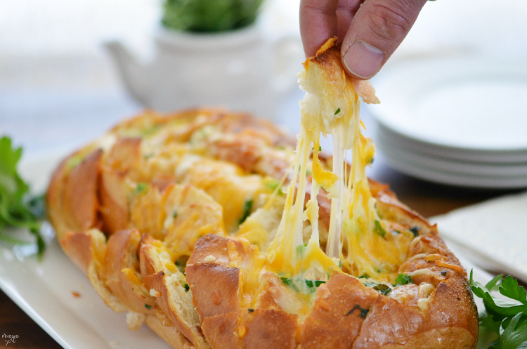 This Cheesy Bacon Pull Apart Bread is the perfect appetizer for your holiday entertaining or game day! This easy to make bread will be a hit with guests!