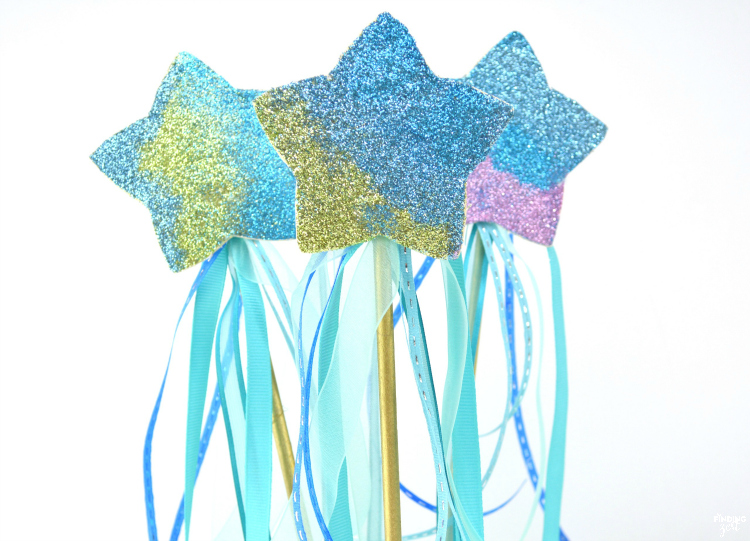 Ever wonder how to make a mermaid wand? These step by step instructions will show you how easy it is to create a magic wand for kids fit for any mermaid fan! Makes for great mermaid birthday party favors or craft activity. Colors can easily be switched out to create a star wand for any princess, fairy or unicorn party.