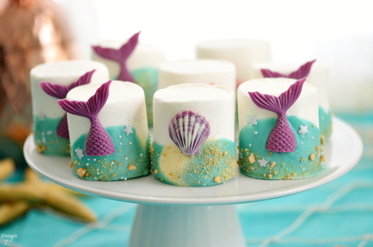 If you are searching for under the sea party ideas, look no further than these mermaid tail marshmallows! This no-bake treat features colorful chocolate mermaid tails and swirled chocolate waves. It is the perfect addition to any mermaid party or under the sea birthday themes!