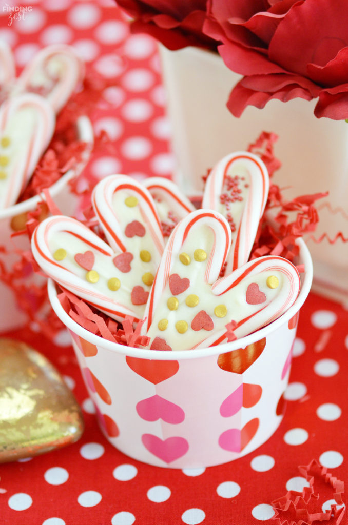 Learn how easy it is to create candy cane hearts, a perfect Valentine's Day treat! Featuring colorful sprinkles, these candy cane hearts with white chocolate are a fun project to make with your kids. If you have ever wondered what to do with leftover candy canes, these treats are for you!