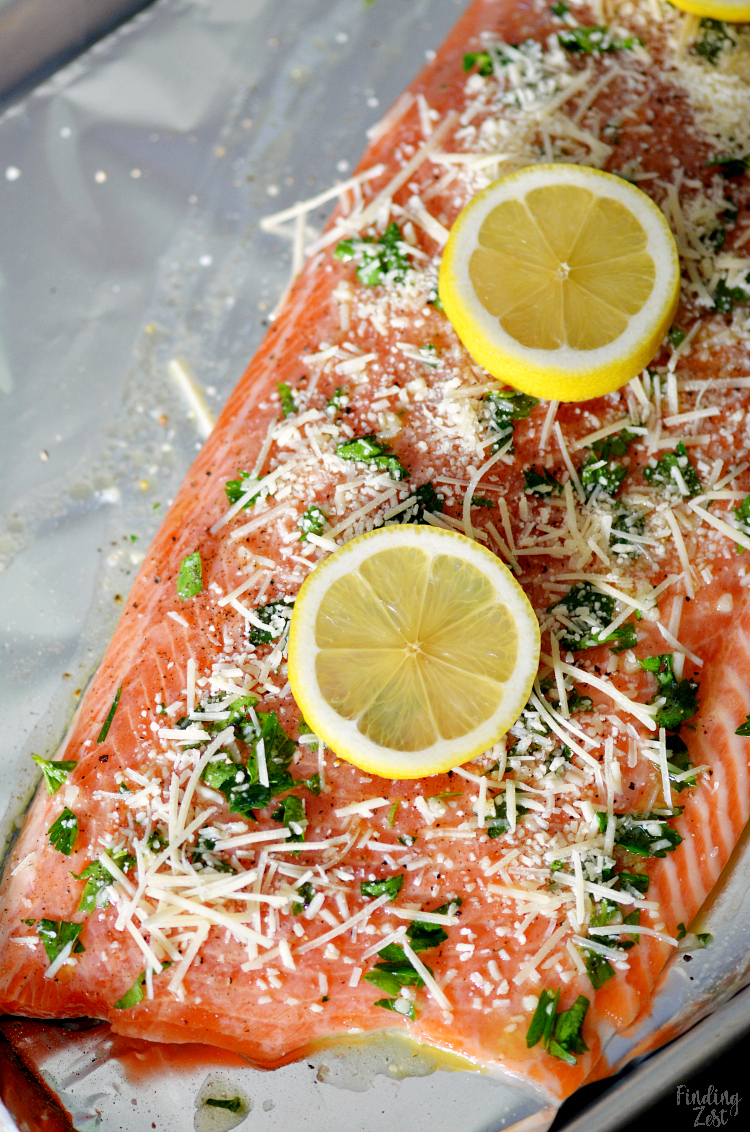 This baked steelhead trout recipe is an easy dinner option and a great alternative to salmon! Loaded with fresh Parmesan cheese, fresh parsley, lemon and garlic, it is sure to become one of your favorite baked fish recipes!