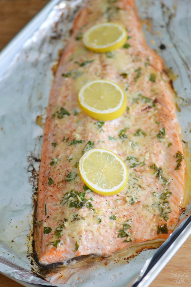 This baked steelhead trout recipe is an easy dinner option and a great alternative to salmon! Loaded with fresh Parmesan cheese, fresh parsley, lemon and garlic, it is sure to become one of your favorite baked fish recipes!