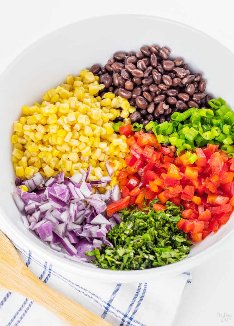 This homemade Black Bean Corn Salsa is sure to be a hit with any crowd! Kick up the flavor to your dinner recipes by serving it as a side dish or as topping to fish, chicken or your favorite Mexican dishes. It also makes for an easy appetizer when served with tortilla chips that everyone will love.