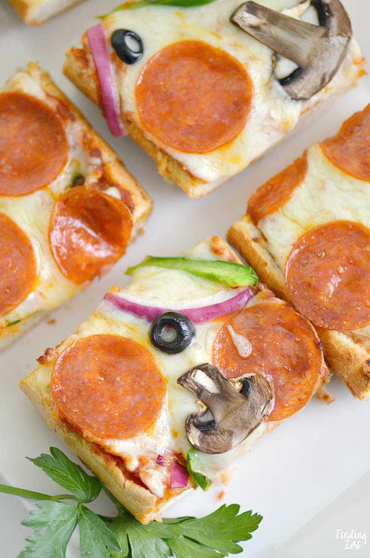 Whip up a delicious and easy weeknight dinner in under 20 minutes with this french bread pizza recipe. Loaded with your favorite pizza toppings including whole milk mozzarella cheese and garlic butter, the flavor is out of this world. Switch up toppings for variety and watch your family devour this pizza bread!