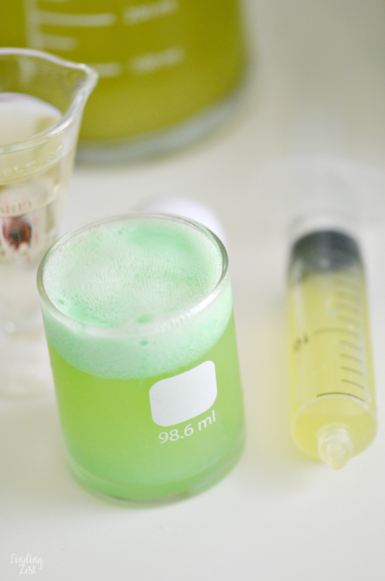 Kids will love this Mad Scientist Green Punch recipe which foams up naturally. Let your punch be the centerpiece of your mad scientist birthday party or Halloween party. Turn your drink into a science experiment and let kids make their own using syringes and beakers!