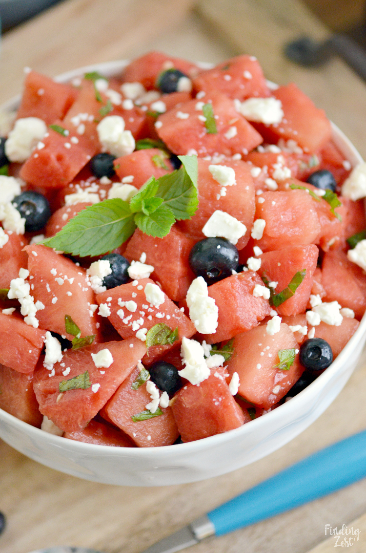 Get a taste of summer exploding in your mouth with this refreshing watermelon mint salad including blueberries and feta! Don't like feta? Feel free to skip it as this balsamic fruit salad recipe is amazing with or without cheese!