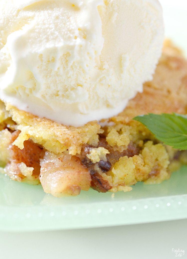 This apple dump cake is a deliciously easy recipe which features fresh apples and a yellow cake mix, no mixer required! The whole family will love this fall dessert served warm with a scoop of vanilla ice cream and you will love how quick this dump cake recipe is to make!