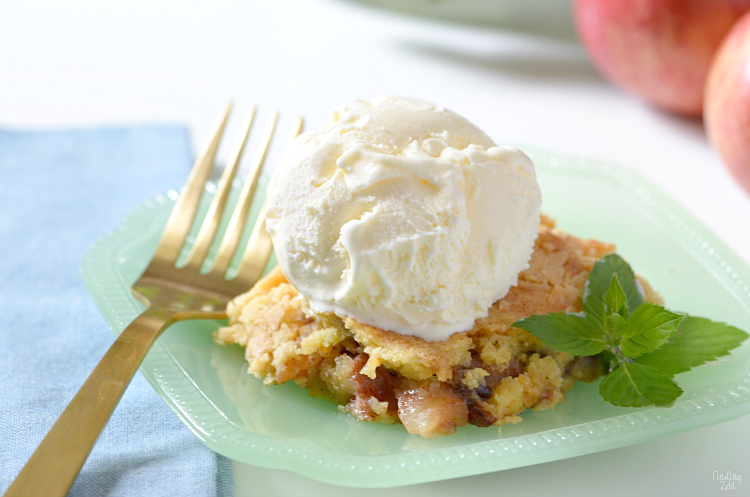 This apple dump cake is a deliciously easy recipe which features fresh apples and a yellow cake mix, no mixer required! The whole family will love this fall dessert served warm with a scoop of vanilla ice cream and you will love how quick this dump cake recipe is to make!