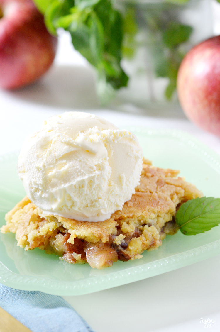 This apple dump cake is a deliciously easy recipe which features fresh apples and a yellow cake mix, no mixer required! The whole family will love this fall dessert served warm with a scoop of vanilla ice cream and you will love how quick this dump cake recipe is to make!