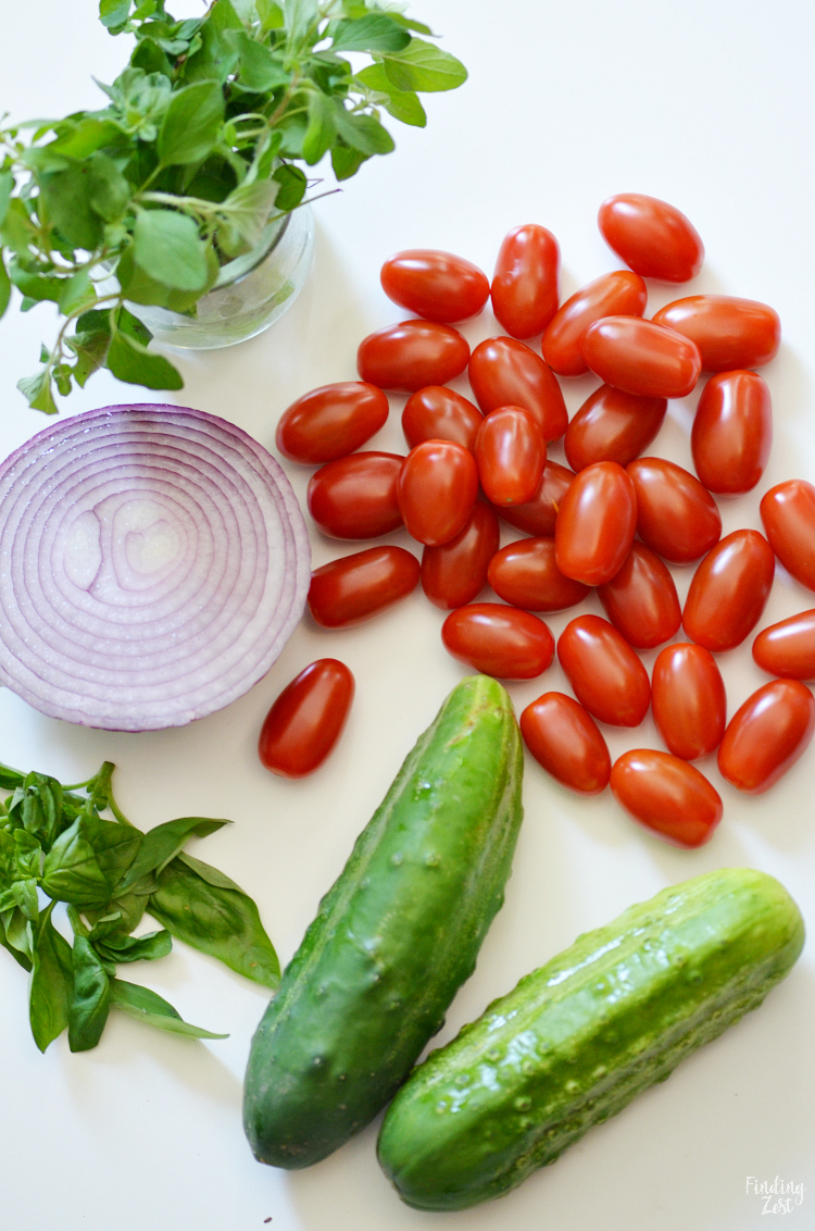 Enjoy this refreshing tomato cucumber salad loaded with fresh herbs, tomatoes, cucumbers, and onion. Let the vegetables marinate in the oil and balsamic vinegar dressing for even more flavor. The perfect side dish for any meal and a great way to use up that fall harvest!
